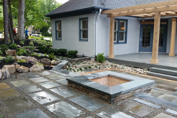 back patio with inground fire pit