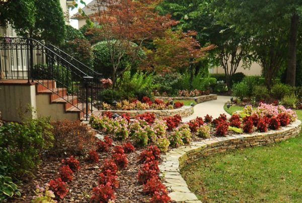 flower bed with stone retaining wall