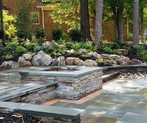 stone patio deck with fire pit