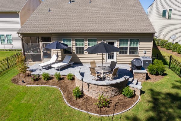 Thoughtful outdoor living featuring a paver patio and lush landscaping