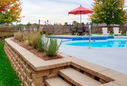 Pool designed by MetroGreenscape with a pool deck and custom landscape in SC