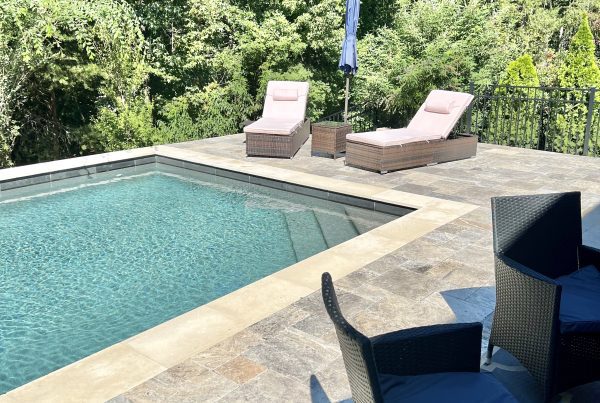 Backyard pool with lounge chairs
