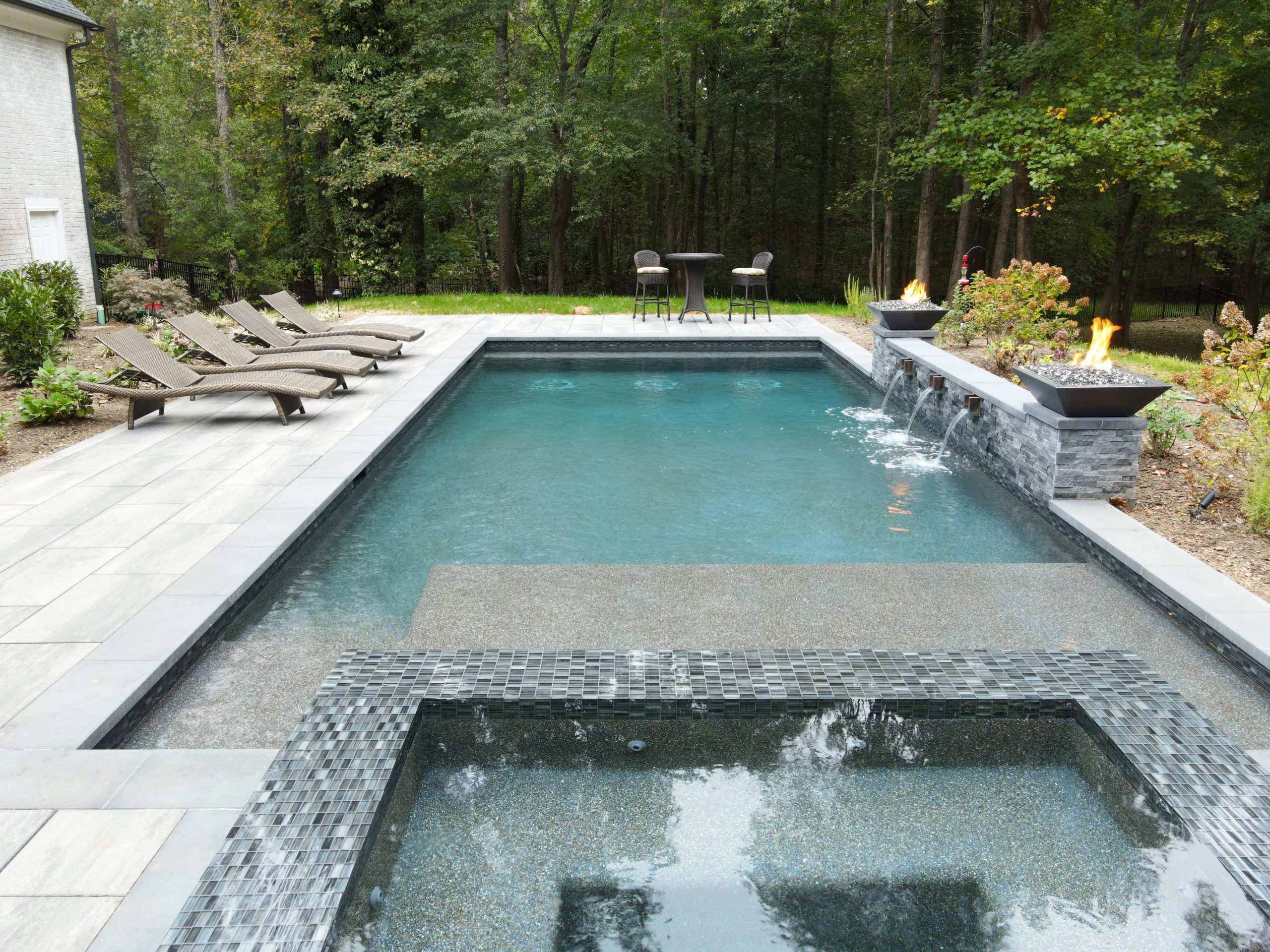 Custom pool with waterfall and hot tub