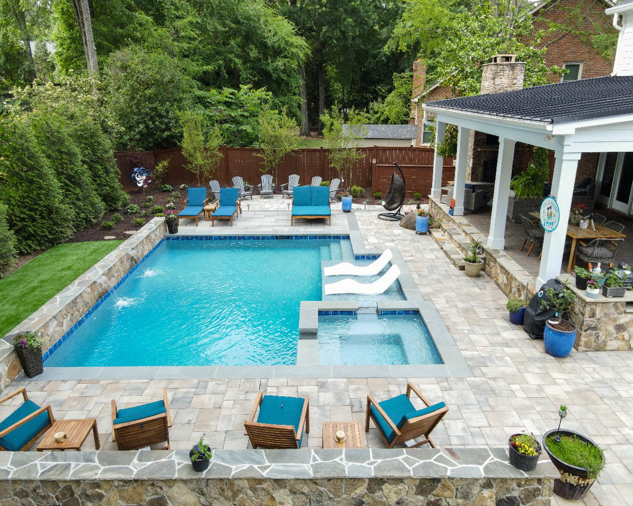 Overview of backyard with pool/hot tub and waterfall