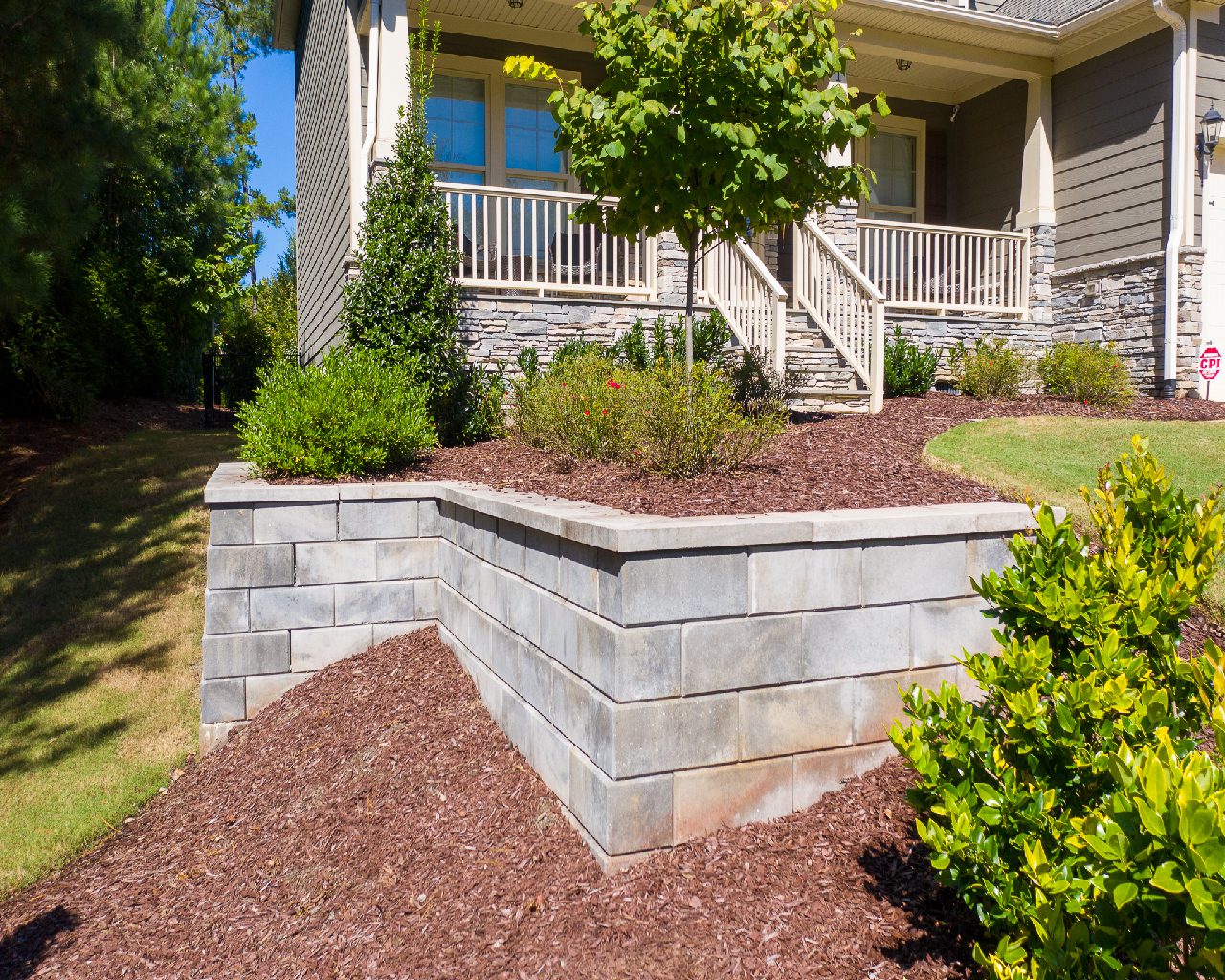 Front yard with retaining wall and landscaping